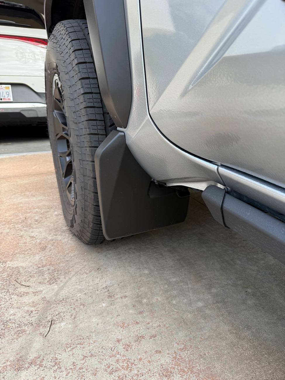 2024 Tacoma OEM mudflaps. Canada vs US. IMG_2773