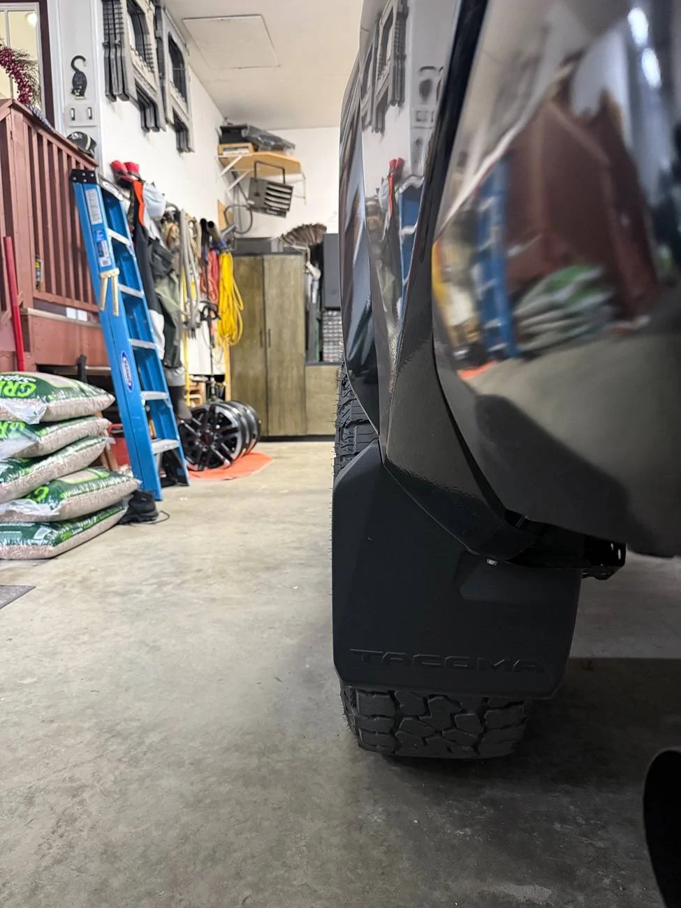 2024 Tacoma OEM mudflaps. Canada vs US. IMG_2456