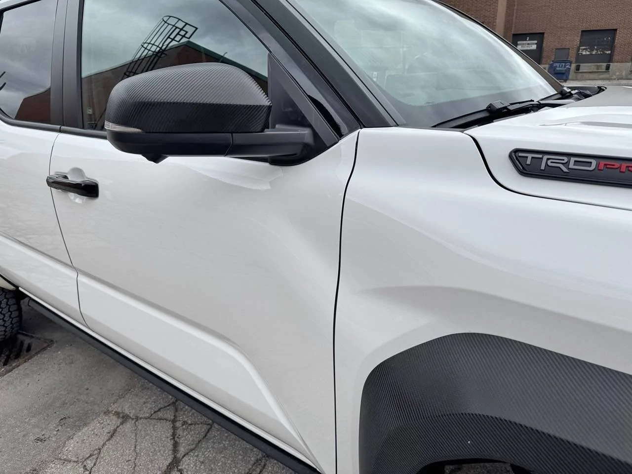 2024 Tacoma 3M carbon fiber wrap on fender flares - White TRD Pro IMG_3452 Larg