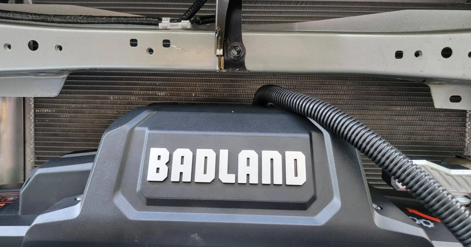 2024 Tacoma Rough Country Winch Mount + Badlands 12k (HF) install on a 4th Gen 2024 Tacoma Hybrid TRD Off-Road. Minimal trimming, huge PITA, but yessir! 1743361023156-ka
