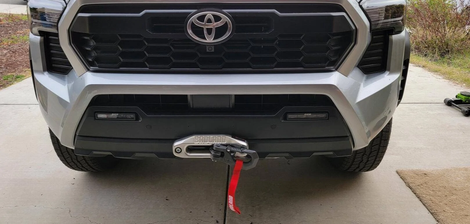 2024 Tacoma Rough Country Winch Mount + Badlands 12k (HF) install on a 4th Gen 2024 Tacoma Hybrid TRD Off-Road. Minimal trimming, huge PITA, but yessir! 1743365712401-6d