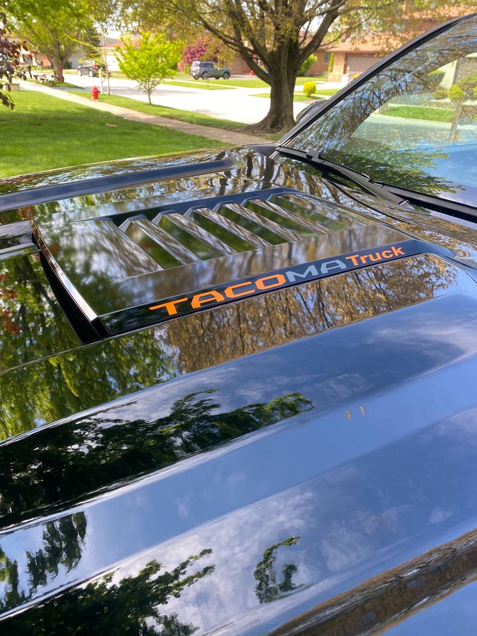2024 Tacoma Black Sport Hood on Bronze Oxide TRD Off Road IMG_2057.JPEG