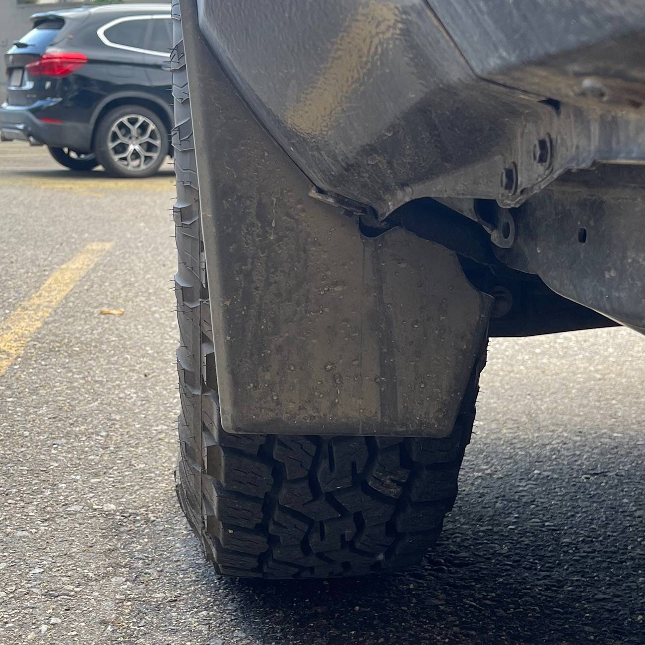 2024 Tacoma OEM mudflaps. Canada vs US. IMG_9348