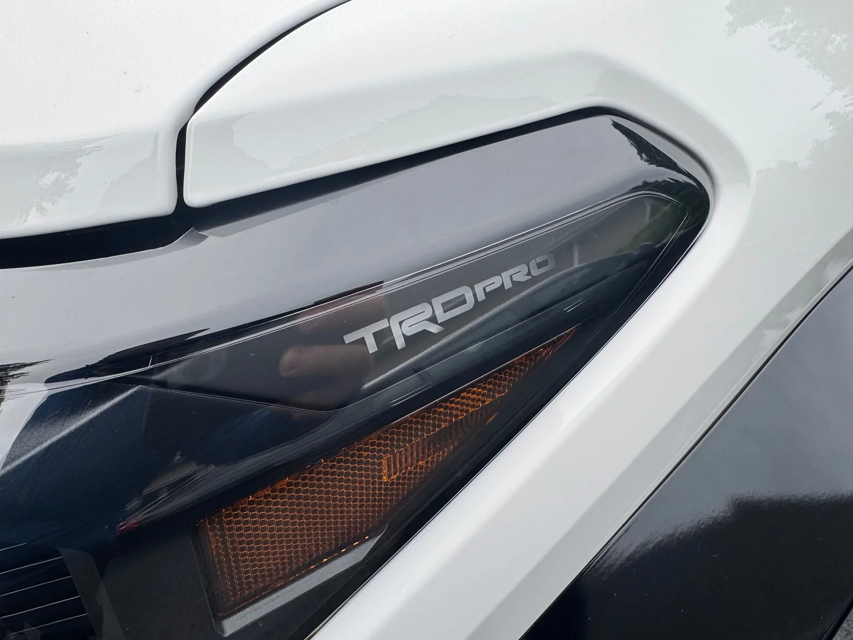 2024 Tacoma Interesting Easter Egg - Japanese words projected onto the headlight cover IMG_7716