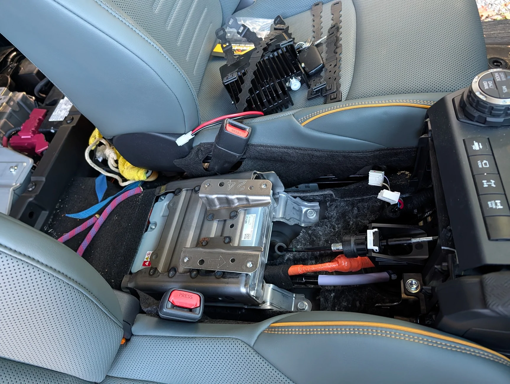 Center console removed for GMRS power source wiring from rear battery.webp
