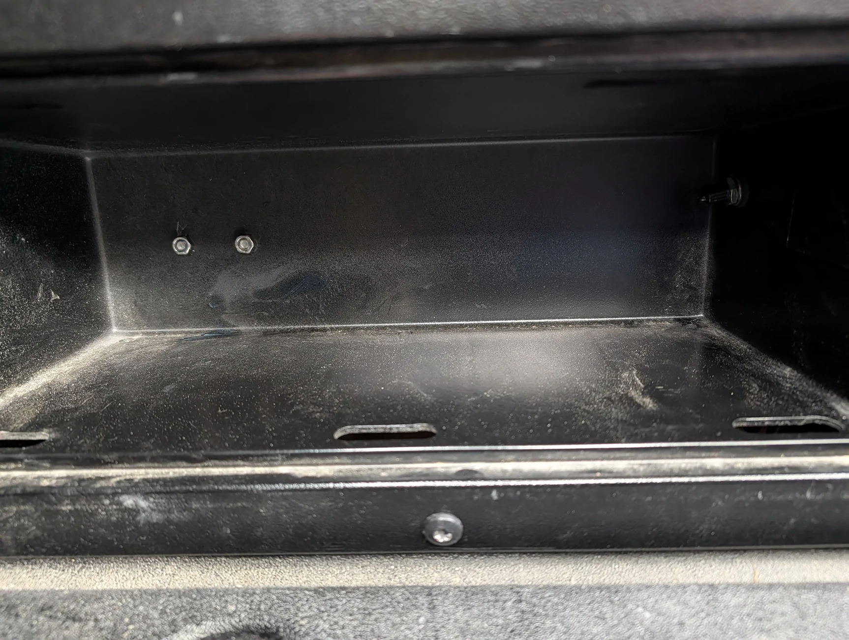 Breather nuts from inside compartment and AirLift valve on right.webp