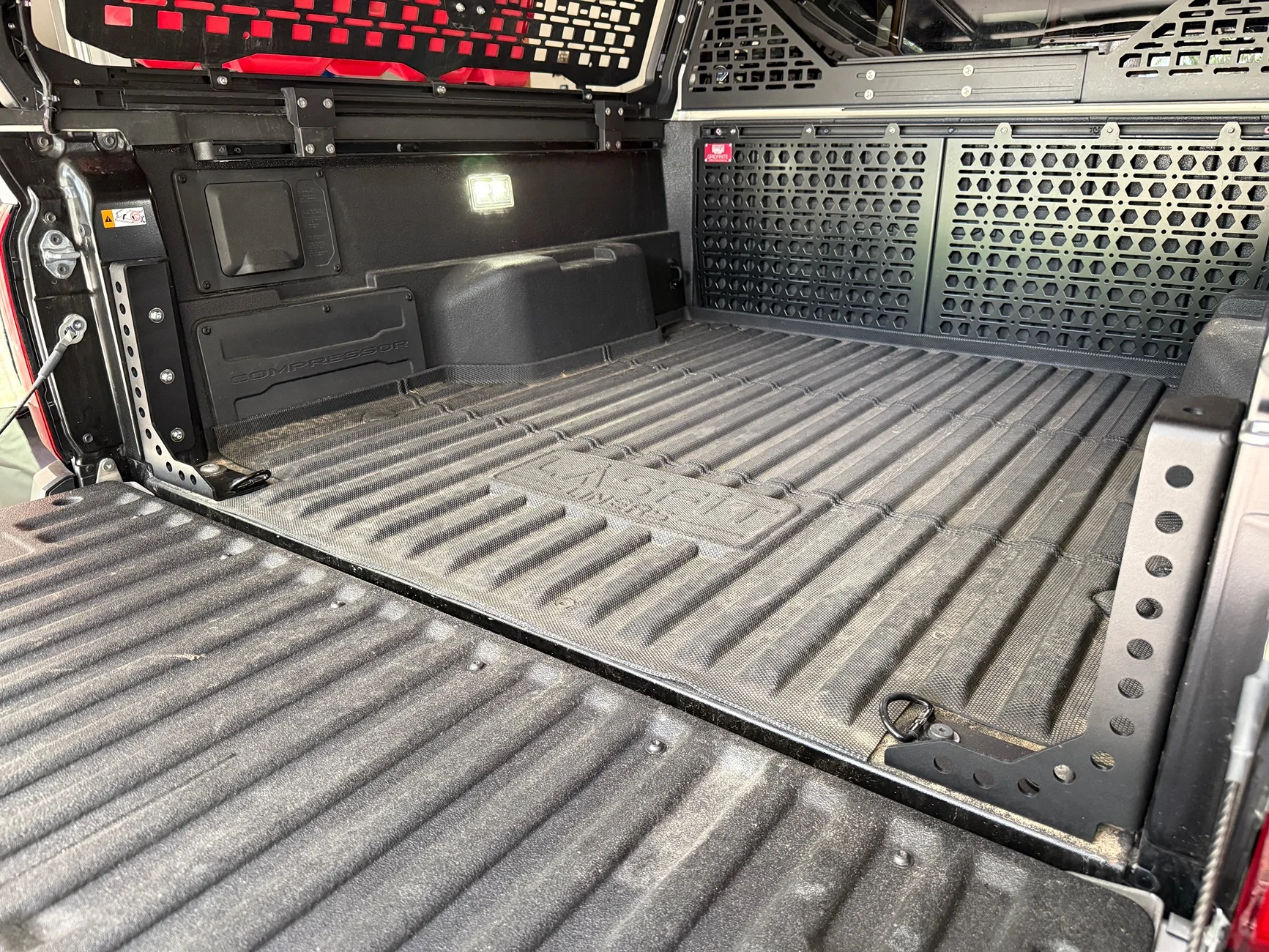 2024 Tacoma Bed stiffeners incompatible with power tailgate IMG_5341