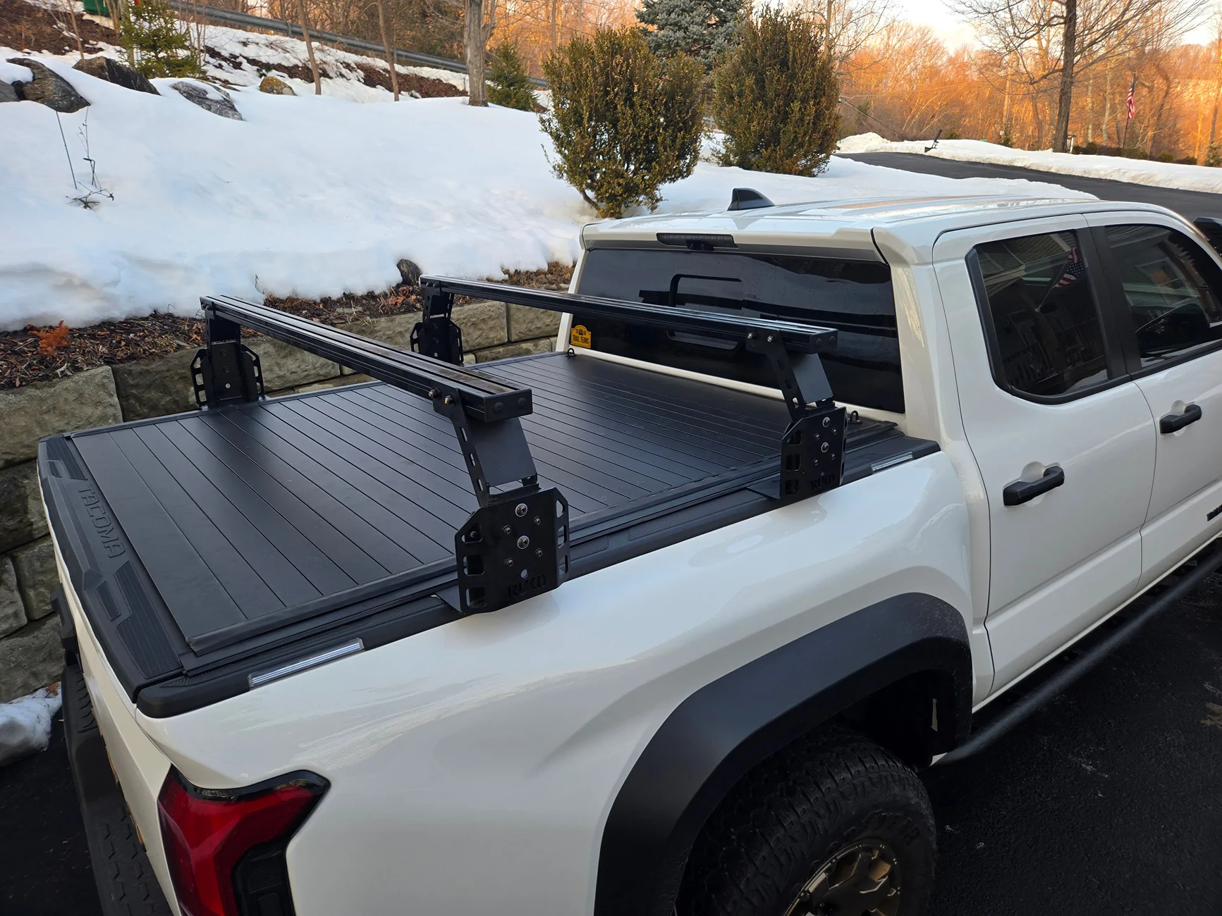 2024 Tacoma Rough Country hard roll up bed cover WITH TRUKD T Series 12.5" Bed Rack Closed rear angl