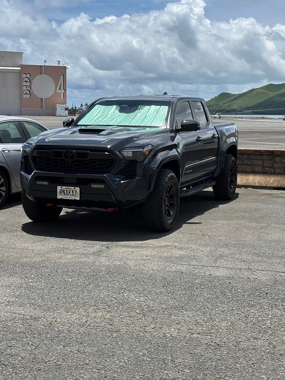 2024 Tacoma OEM mudflaps. Canada vs US. IMG_9727