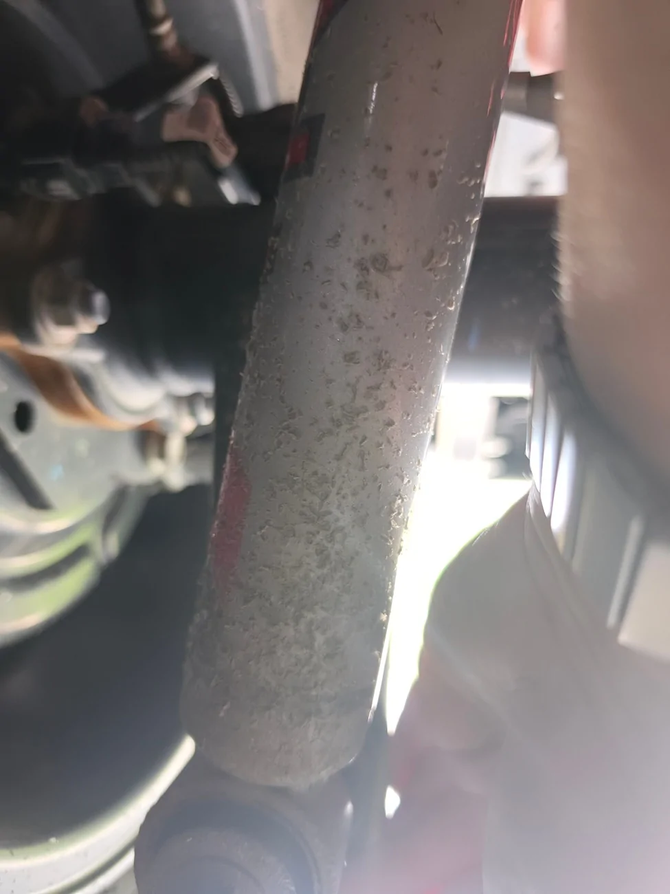 2024 Tacoma Severe Rock/ Gravel chip damage on rear shocks and frame 1737