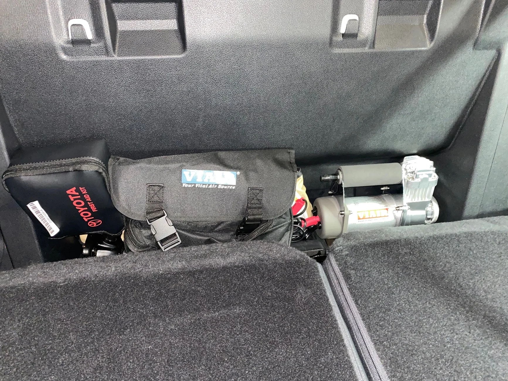 2024 Tacoma Portable compressor fitment behind the rear seat IMG_5176