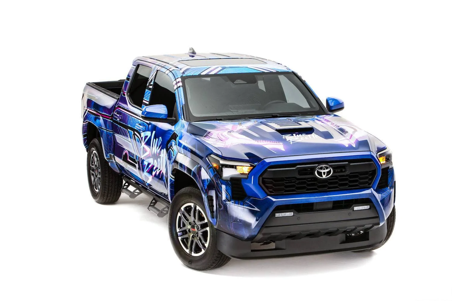 2024 Tacoma Toyota @ SEMA 2023 Preview: "Track or Trail, Your Thrill Awaits" Tacoma_Blue_Beetle_Toyota_SEMA_2023_Hi-Res_Hero-scaled