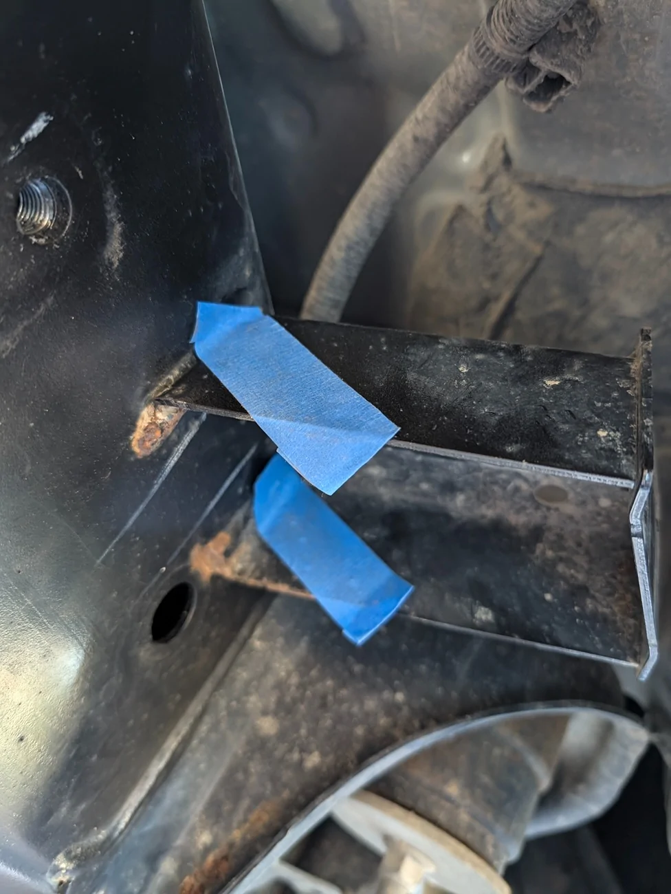 Taped off bracket to guide cuts.webp