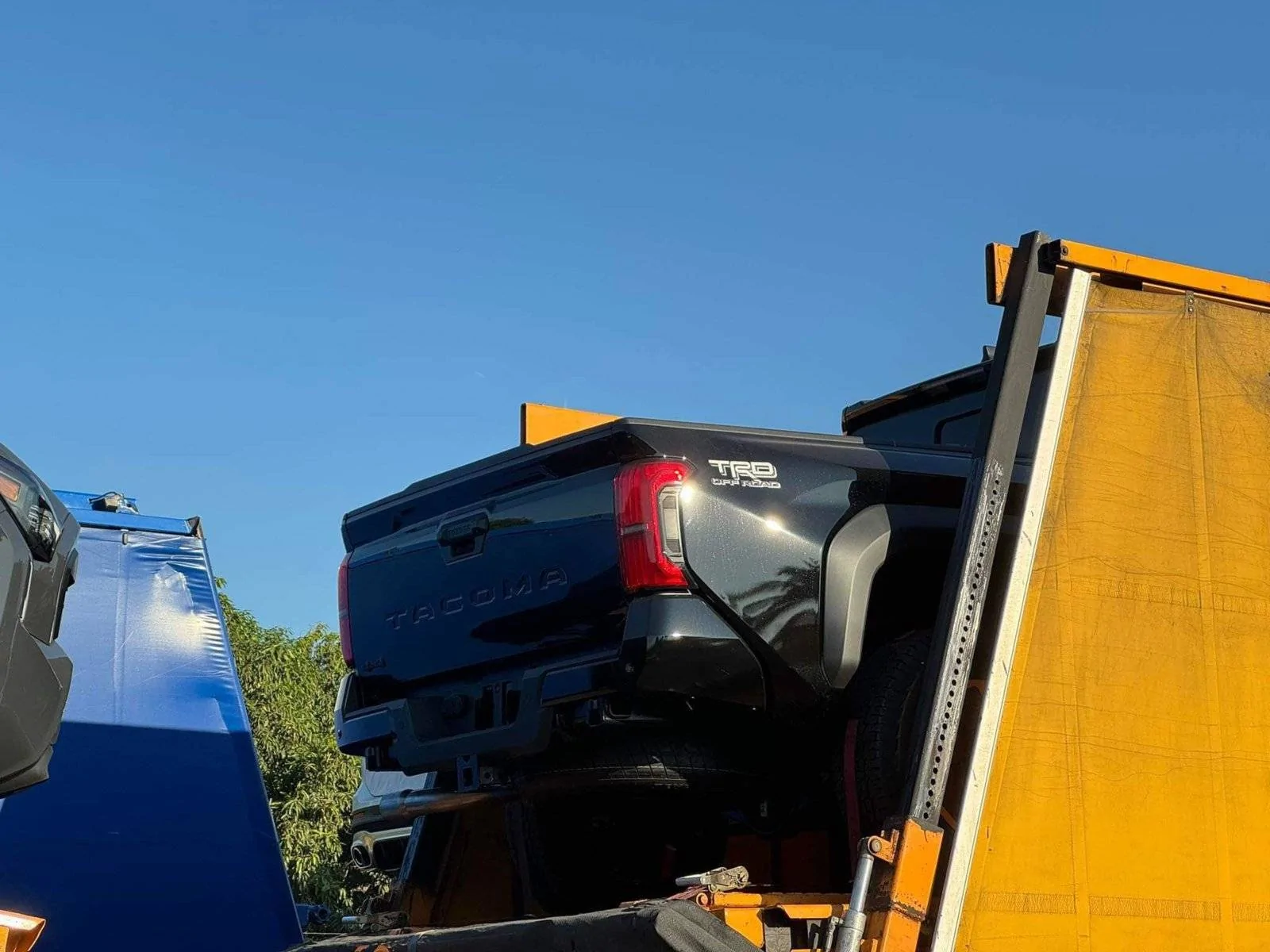 2024 Tacoma 2024 Tacoma Off-Road & Sport trims spotted up close on transport trucks Black 2024 Tacoma TRD Off-Road