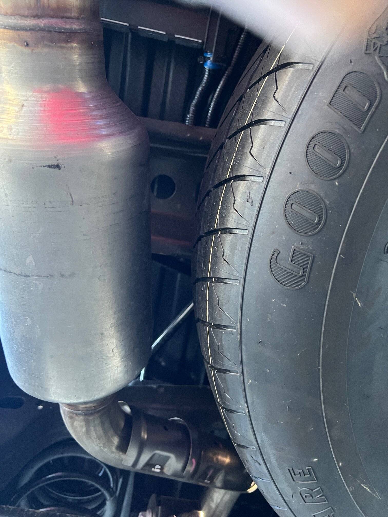 2024 Tacoma Not much room for a larger spare tire under our trucks IMG_5475