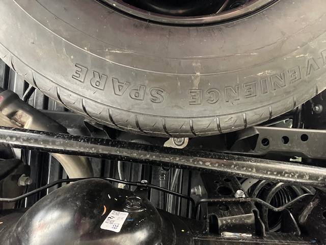 2024 Tacoma Not much room for a larger spare tire under our trucks IMG_6116