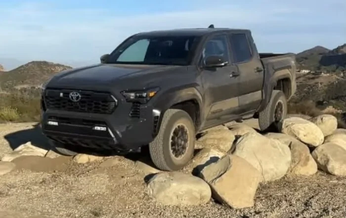2024 Toyota Tacoma TRD Offroad climbing over rocks / terrain course