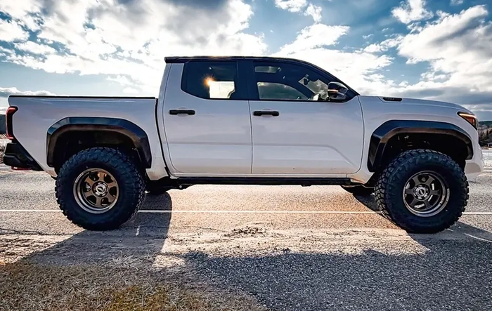 Tacoma TRD Pro on 17x8.5 -10 offset Rays TE37xt-SL M Spec wheels, 35x12.5r17 Toyo Open Country RT Pro tires, Westcott Preload Collar Lift