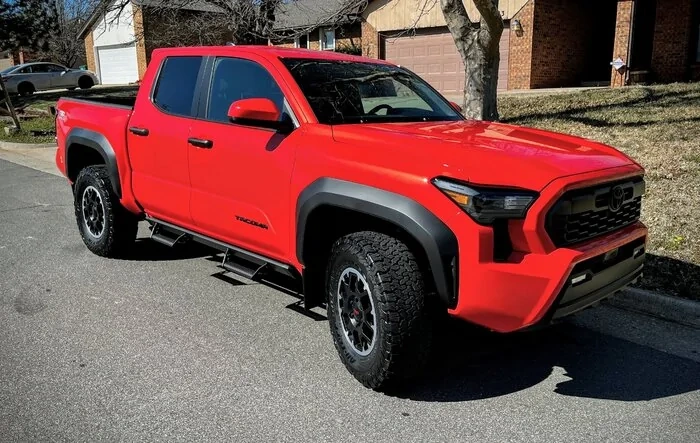 285/70/17 tires (BFG All-Terrain T/A) on stock wheels, no poke, no trim, no cab mount removal (2024 TRD Off-Road)